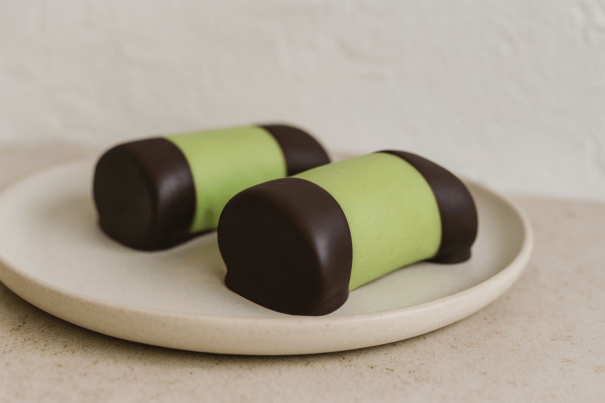 Swedish dammsugare punch rolls with green marzipan coating